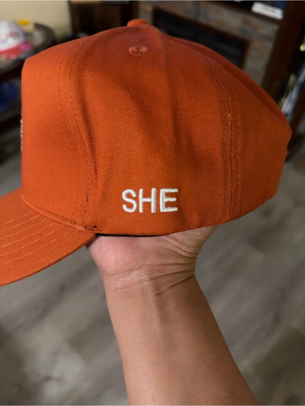 She Darc Sport Orange Cap with White Wolf Emblem